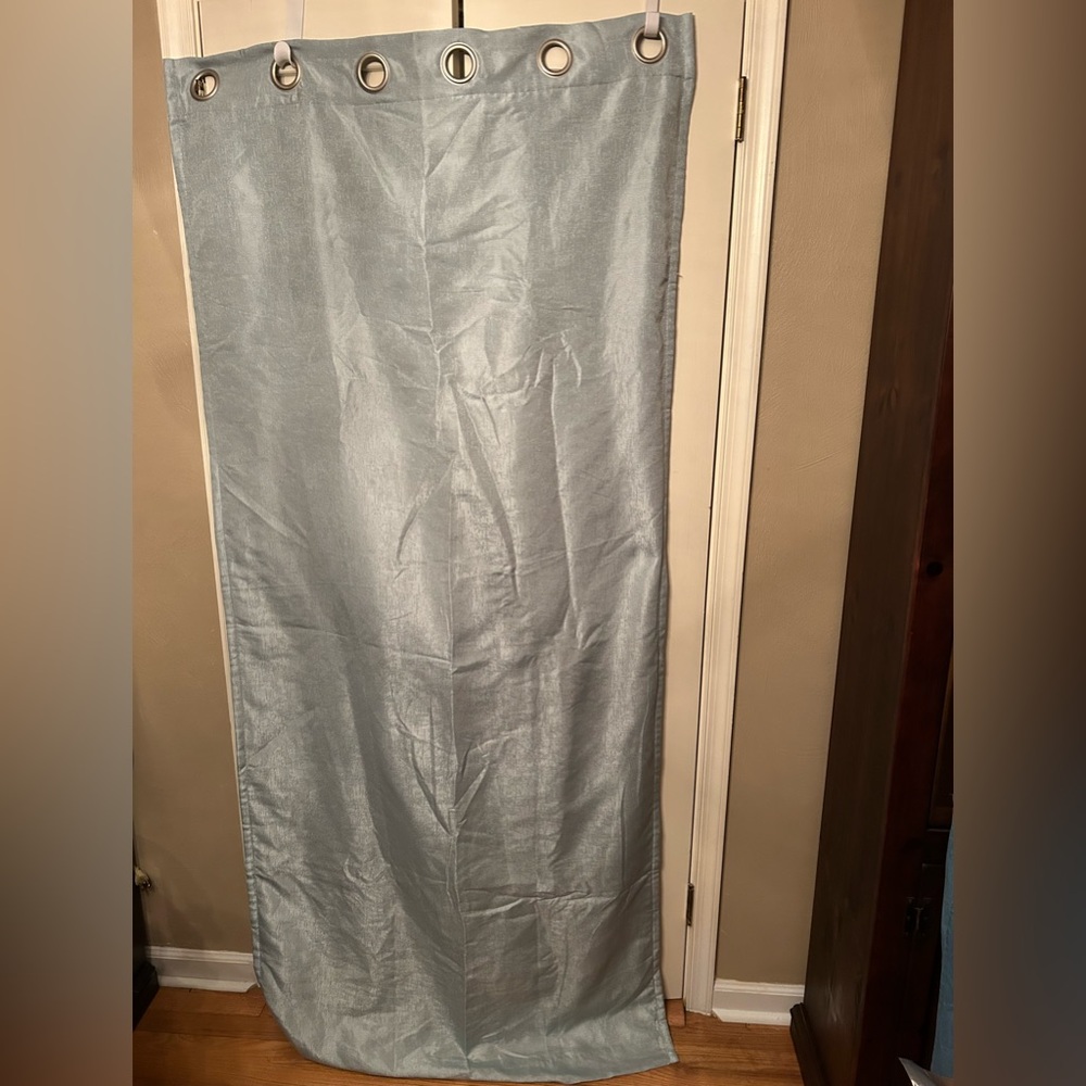 One Pair, Lt Blue Grommet Curtain Panels, ea w/6 silvertone rod grommets. Lined.